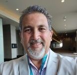 Personality of the Month – Amando Queiroga Realm Professional Realtor and Business Consultant.